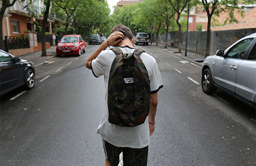 kid walking in the street